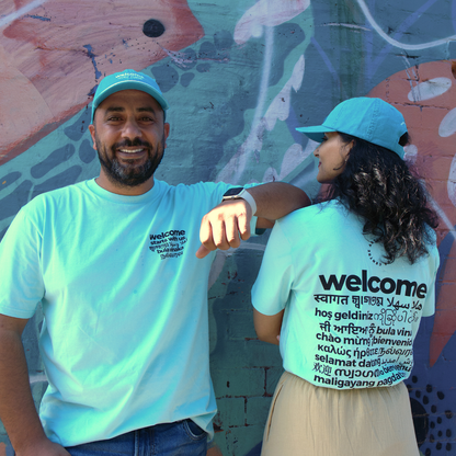 "Welcome starts with us" Blue T-Shirt in 19 Languages